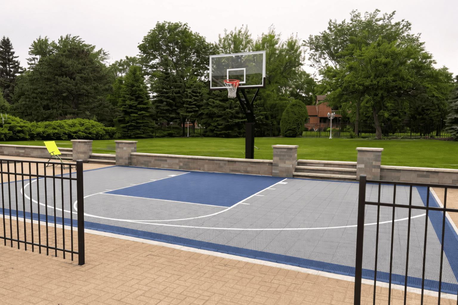 Backyard basketball court on overcast day