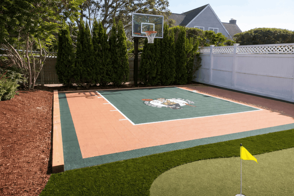 Backyard basketball court with mascot logo