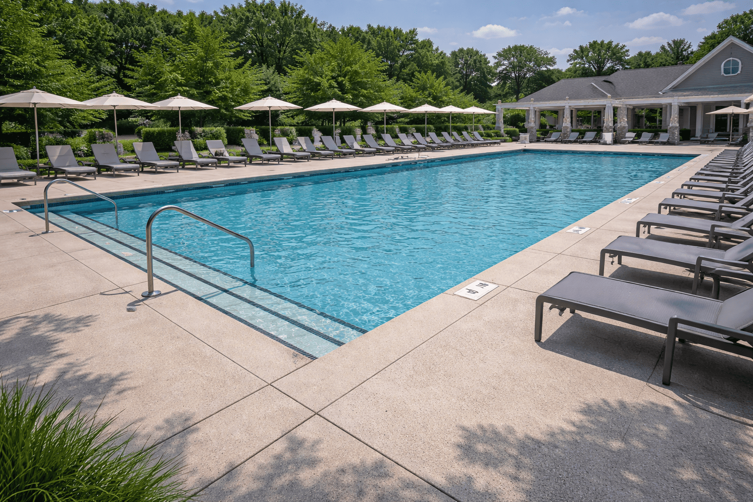 Sunny poolside retreat with lounge chairs