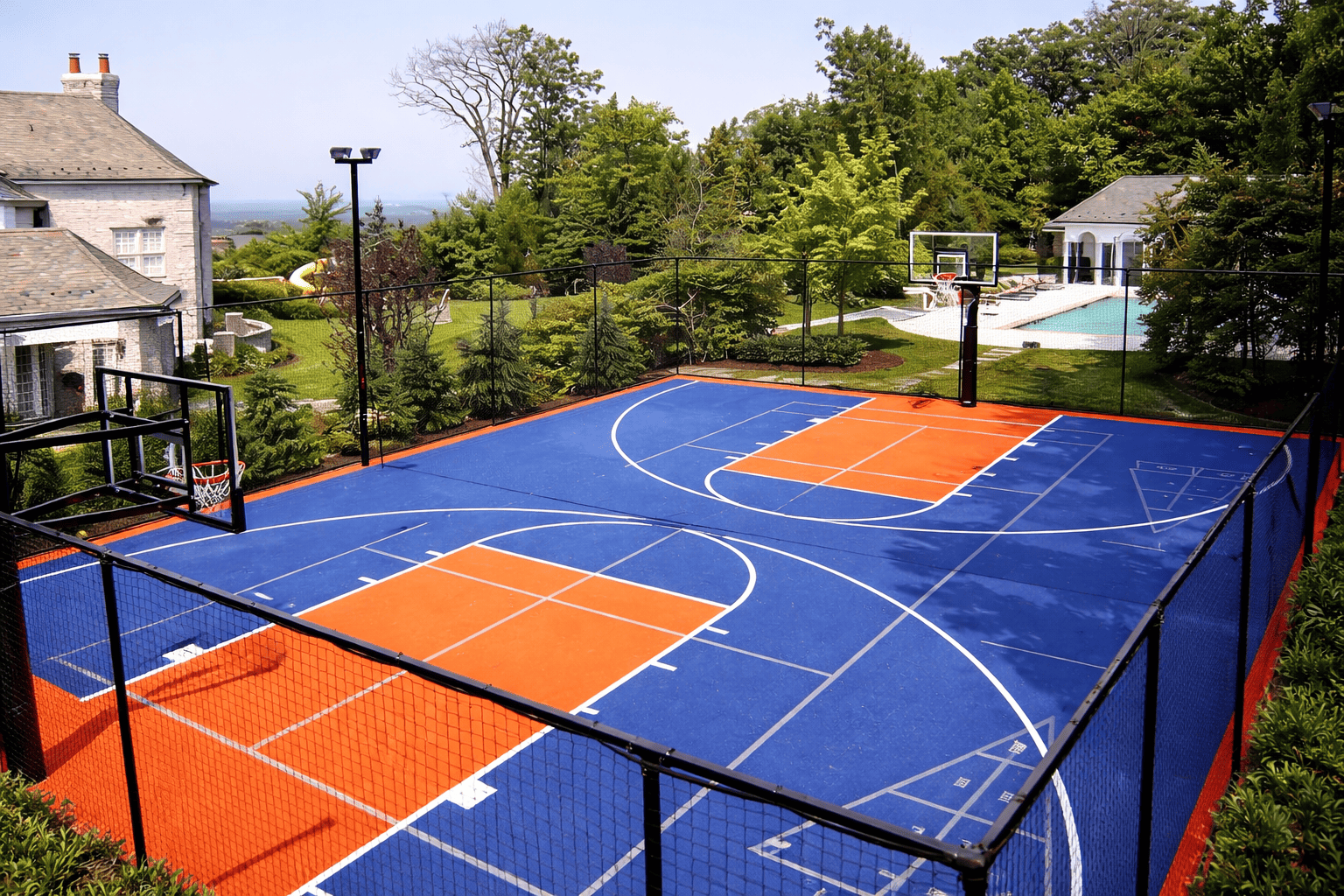 Vibrant backyard basketball court at midday