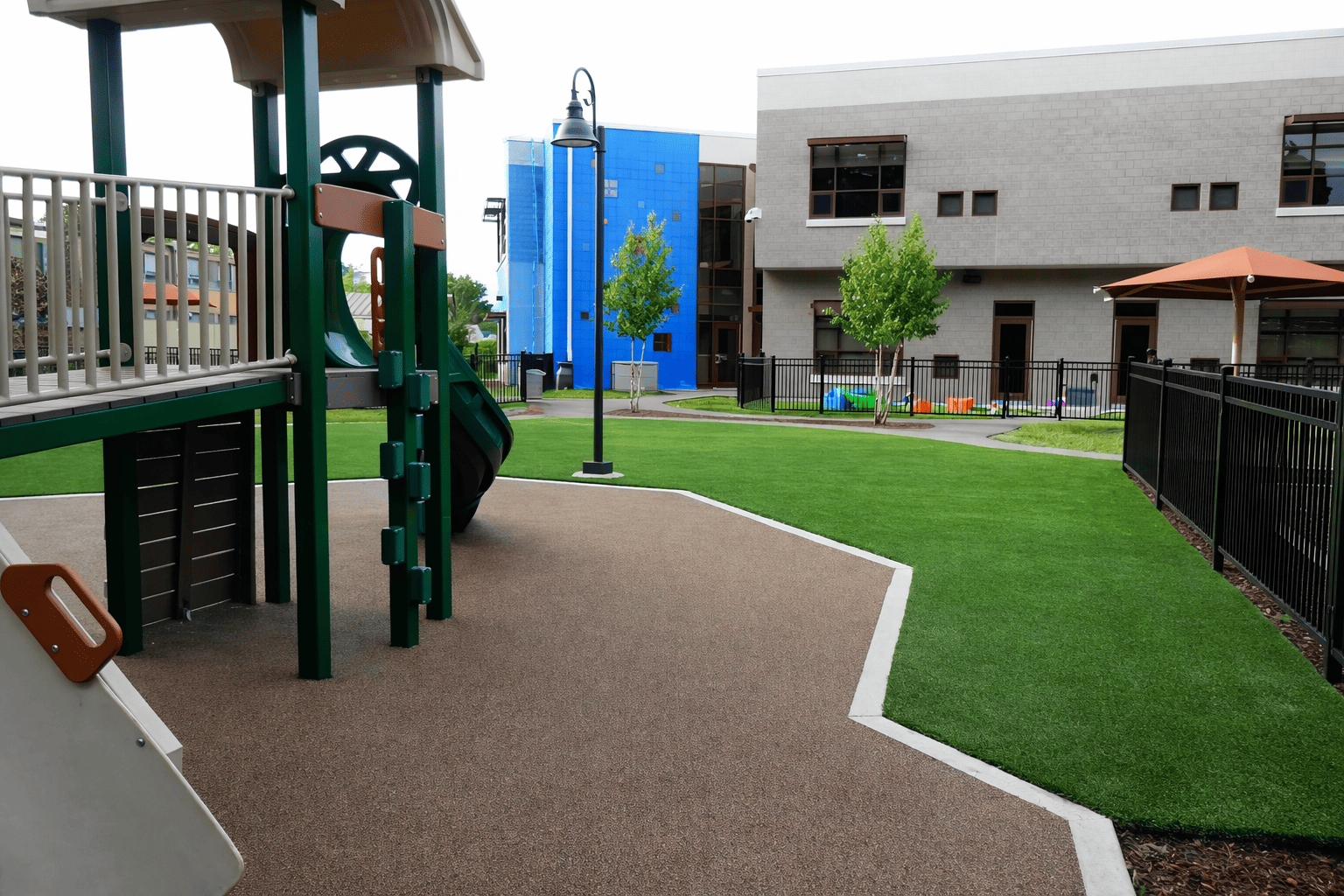 Playground with slide and greenery