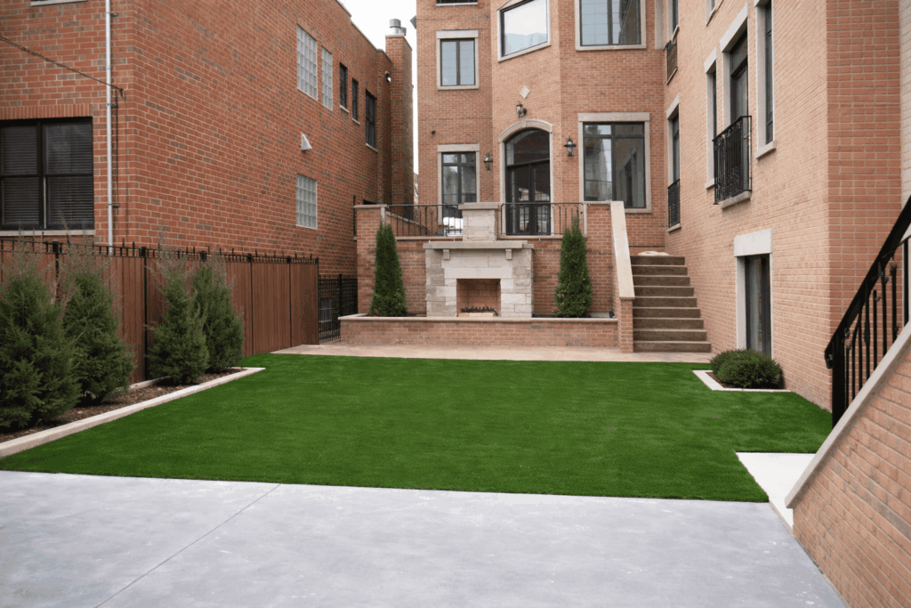 Urban backyard with fireplace and greenery